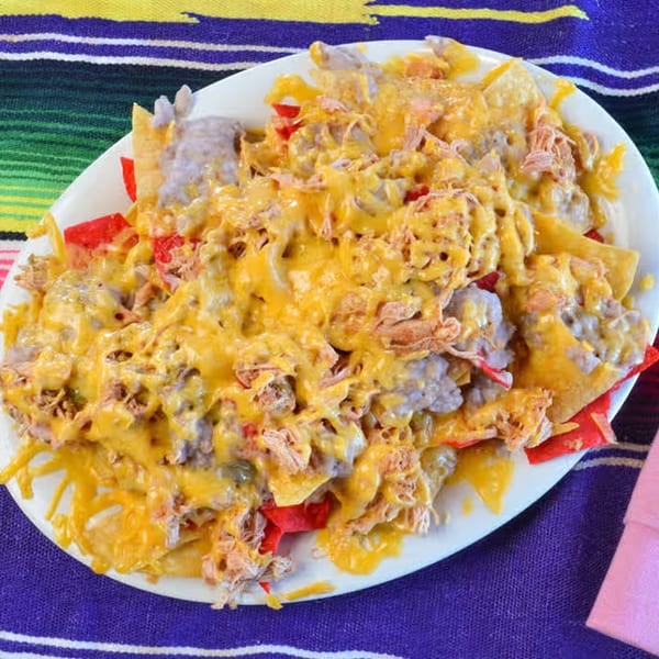 La Casita Mexican Grill's nachos with melted cheese, shredded chicken, and red tortilla chips.